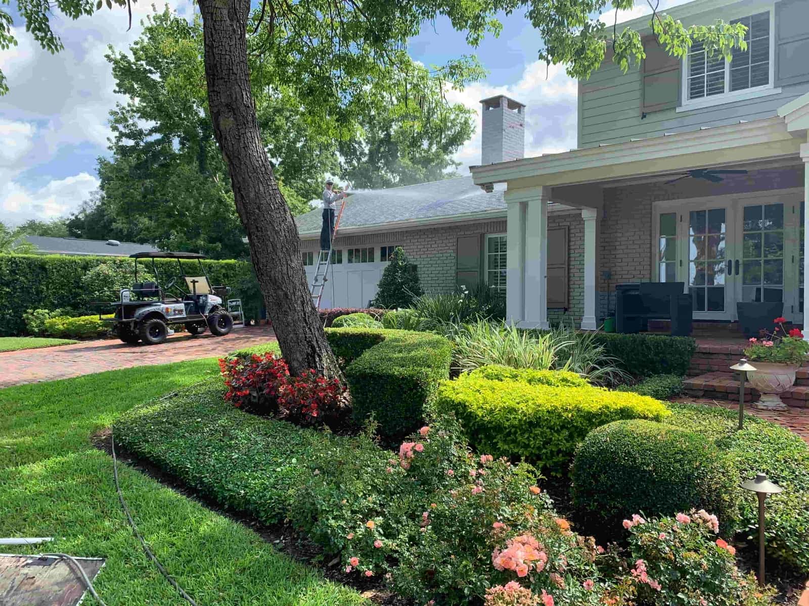 Orlando Window Cleaning technician soft washing a Central Florida home